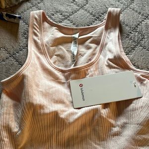 NWT. size 6 baby pink tank crop. Tight fit